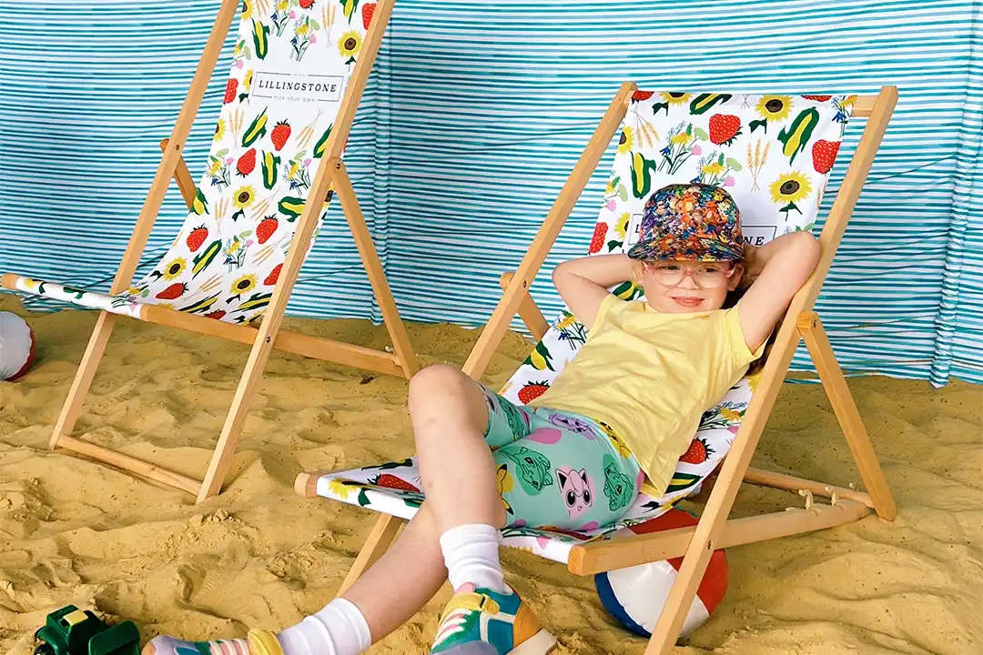 Summer Adventures 9 A child relaxed in the beach chairs at lillingstone pick your own farm's beach