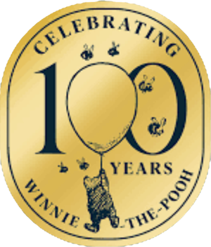 a gold badge with the text celebrating 100 years of winnie the pooh