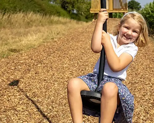 Young girl rides the zip line at Lillingstone Pick Your Own farm